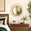 Decorative gold wall mirror styled beside bedroom furniture