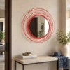 MORii red metal mirror styled in modern entryway