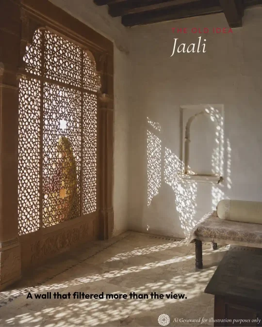 Traditional Indian interior illuminated through an intricately carved jaali screen.