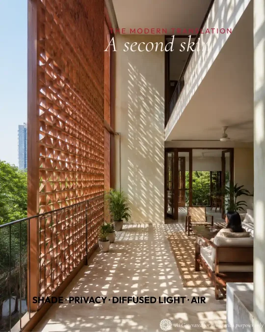Bright modern Indian residence with a deep terracotta jaali façade casting patterned shadows.